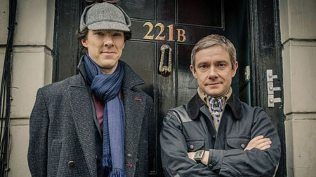 Sherlock Holmes and John Watson outside 221B Baker Street.